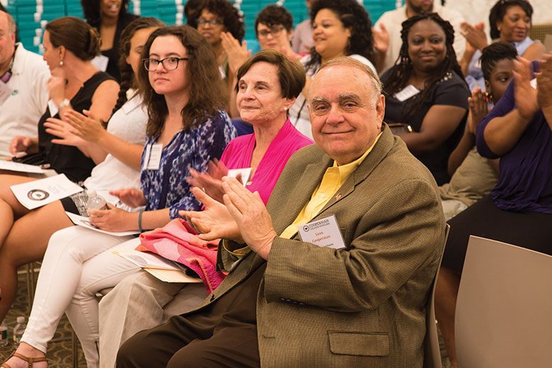 Leon Cooperman, right, and wife Toby, applaud the initial class of Cooperman College Scholars at a June gathering in Newark.