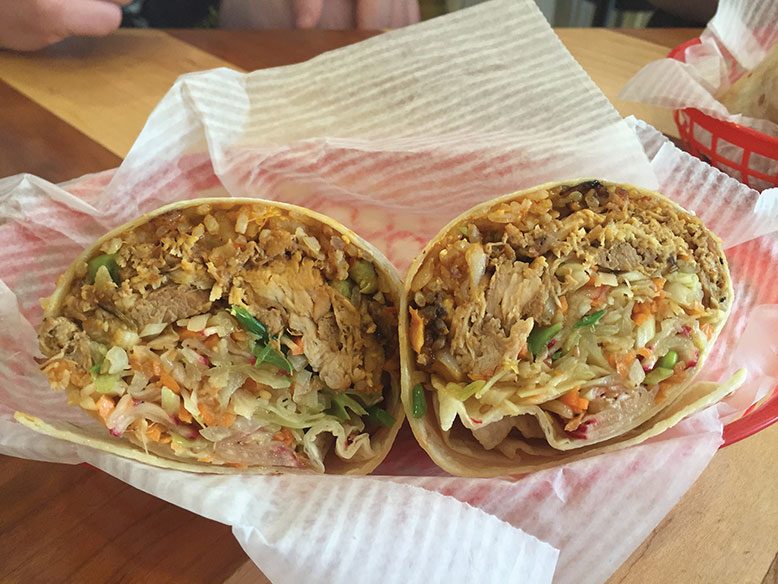 The soy-ginger chicken burrito with ponzu-sesame slaw and kimchi fried rice.