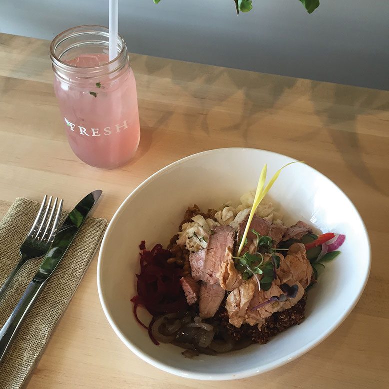 A grain bowl including puréed sweet potato, infused beets, pickled cauliflower, grilled red onion, quinoa, rye berries and all three available proteins.