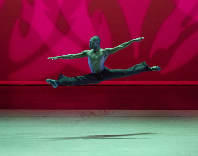 Chalvar Monteiro leaps across the floor during "Revelations," choreographed by Alvin Ailey.