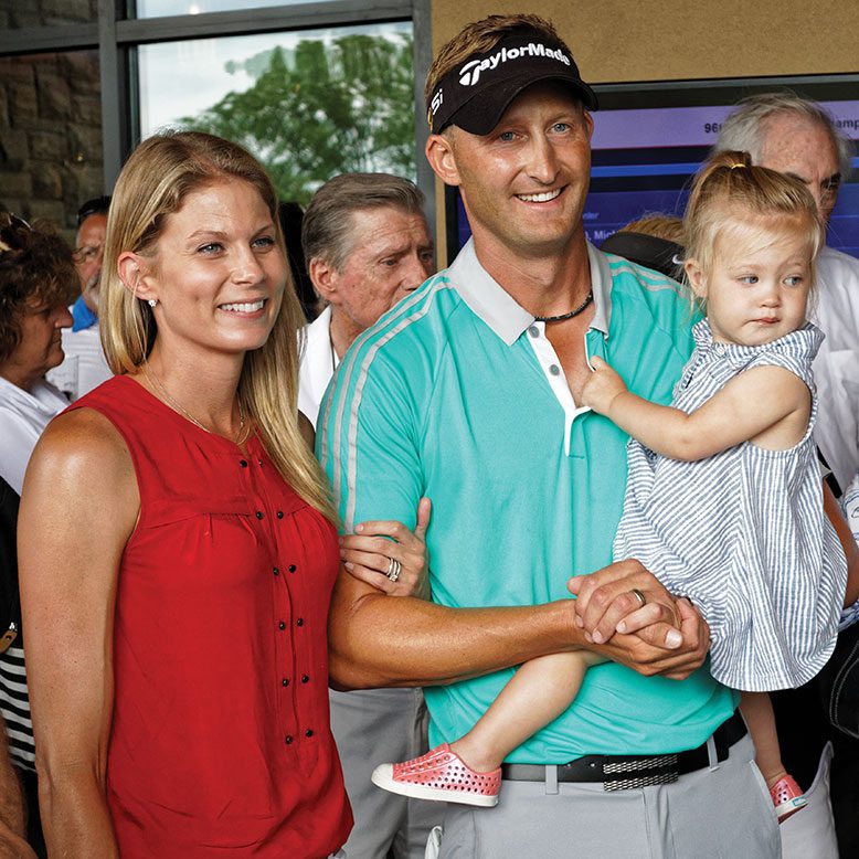 Top golfer Tyler Hall with wife Brianna and their daughter, Finley. Although he’s no longer on the pro tour, Hall still has ambitions to compete in the majors.