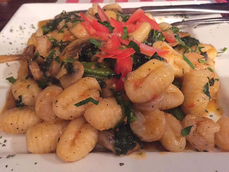 Gnocchi with shrimp, broccoli rabe, mushrooms, fresh tomatoes, garlic and oil and a touch of marinara.