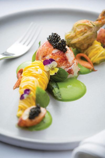 Lobster with squash crudo, blossom fritter and cavier.