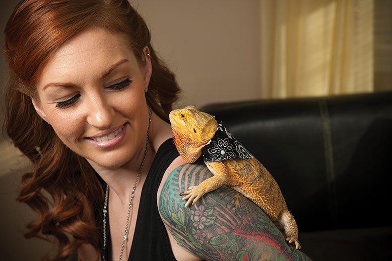 Kerri Joyce shares some love with Cinder, her 4-year-old bearded dragon.