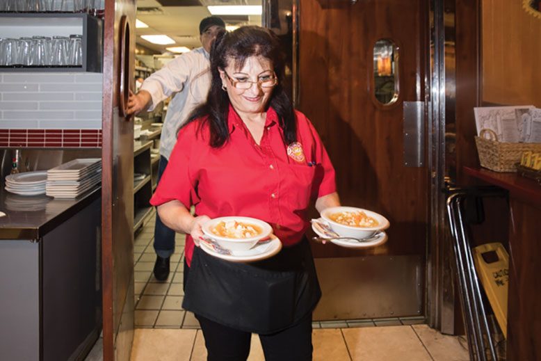 Amal "Molly" Kaydouh works her shift at the Nevada in Bloomfield.
