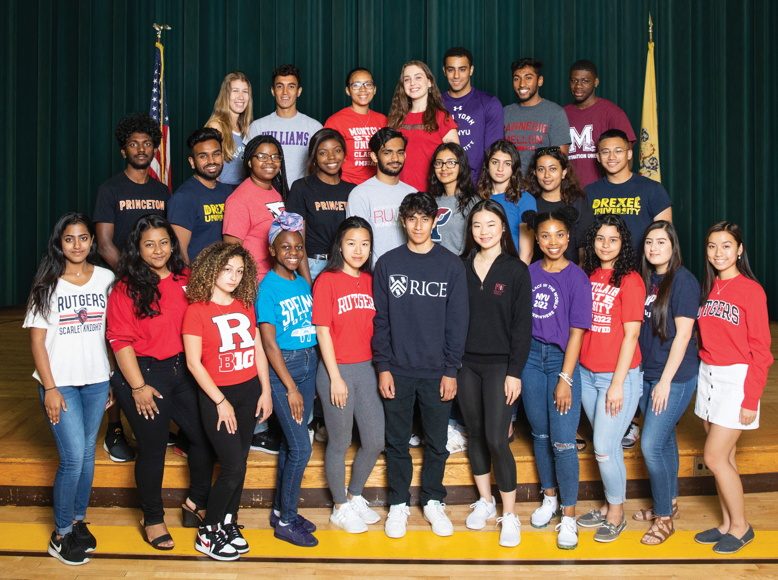 Following school tradition, members of the McNair Academic graduating class of 2018 donned T-shirts from their future colleges for graduation practice last spring.