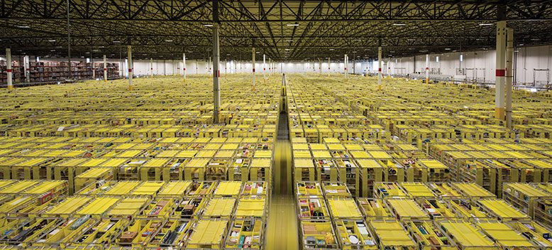 A sea of merchandise stored in thousands of yellow pods fills Amazon’s 1.1 million-square-foot fulfillment center in Carteret.