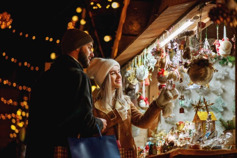 Young couple browsing at holiday market