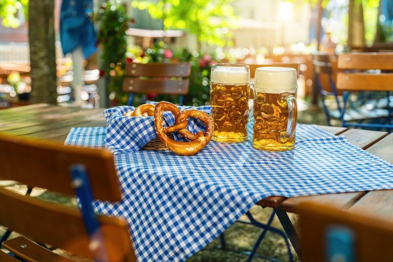 Oktoberfest table of beers and pretzel