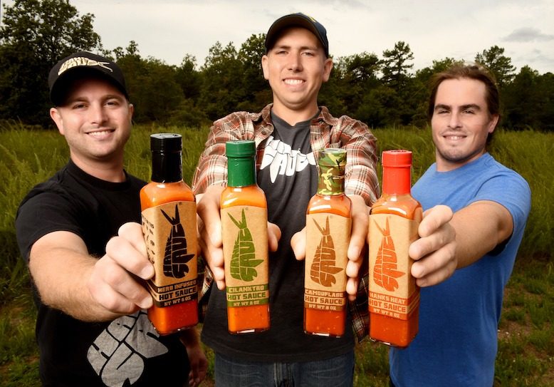 Brian "Hank" Ruxton, Josh Jaspan and Matt Pittaluga show their “Core Four” of sauces: Herb Infused, Cilanktro, Camouflage and Hank’s Heat.