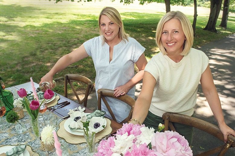 Spoon + Salt founders Courtney Curzi Murray and Amy Tomlinson at an outdoor tablescape