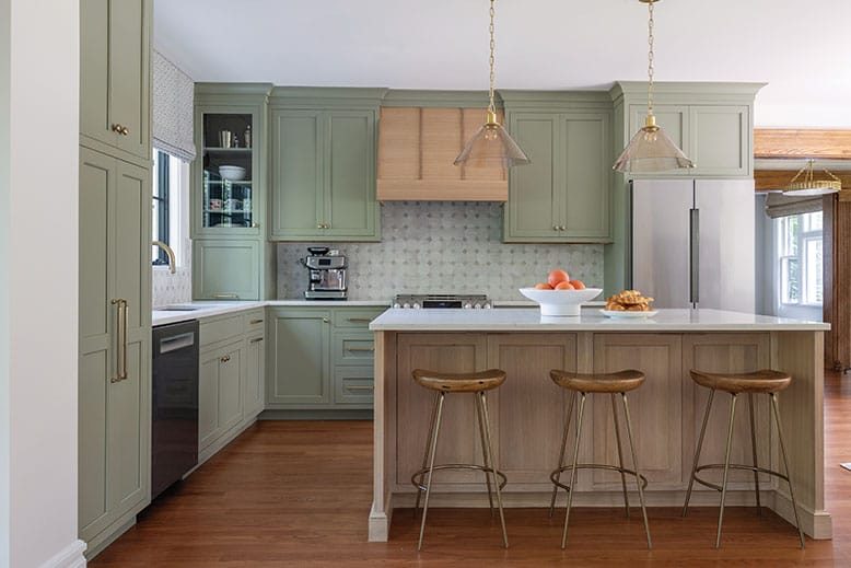 Kitchen with light green cabinets