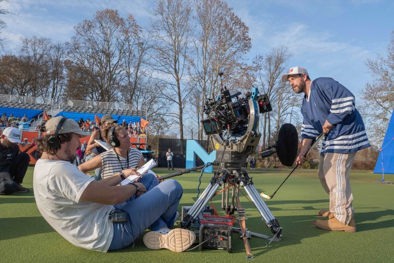 Adam Sandler poses with a golf club filming a "Happy Gilmore 2" scene with director Kyle Newacheck