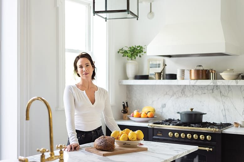 Woman in kitchen of Jersey City brownstone